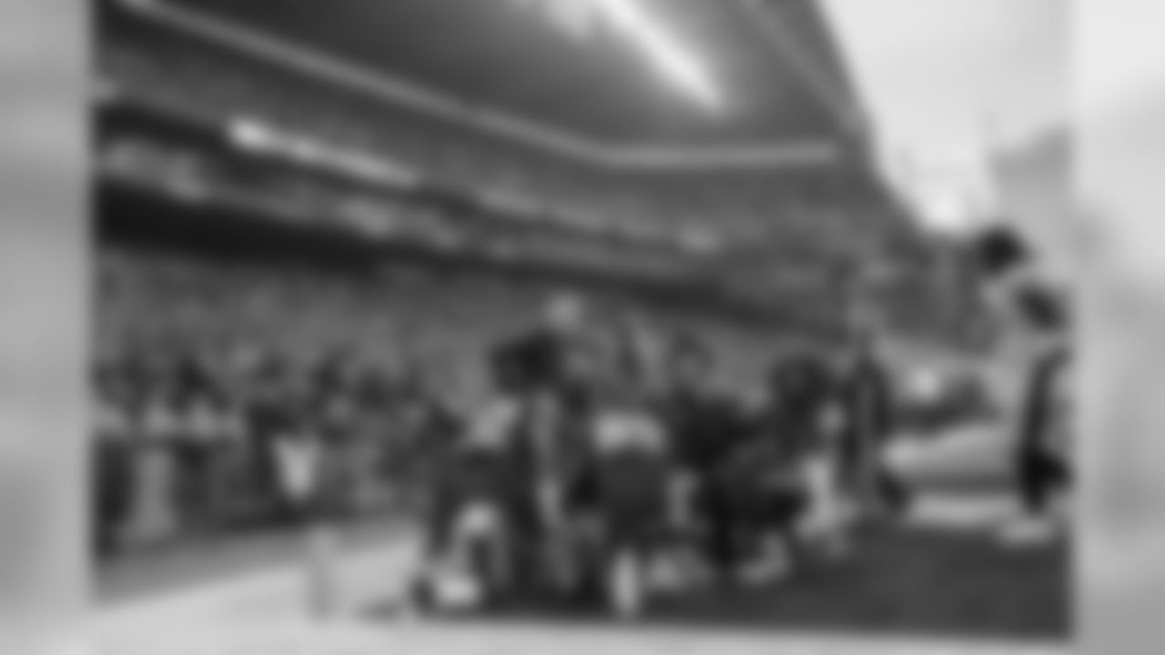 Teammates and head coach Pete Carroll huddle around injured Jimmy Graham after the tight end was injured trying to catch a pass in the end zone in the fourth quarter.