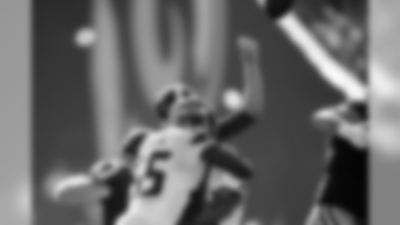 Seattle's Frank Clark knocks the ball away from Rams quarterback Jared Goff in the fourth quarter.