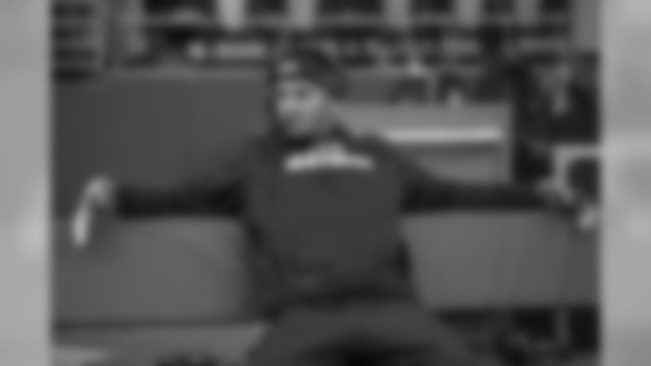 Jermaine Kearse relaxes on the Seahawks bench while doing a radio interview hours before kickoff.