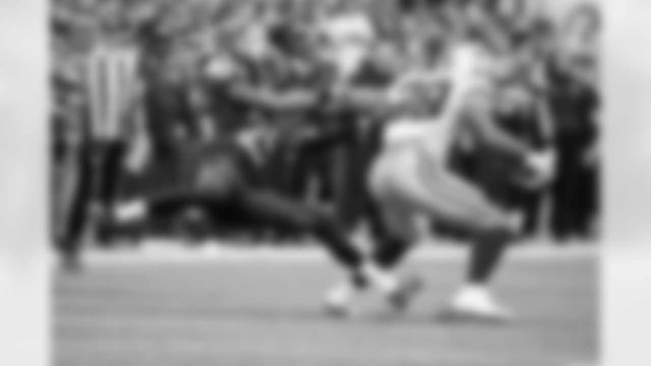 Cornerback Richard Sherman grabs the arm of Dallas running back DeMarco Murray in the fourth quarter.