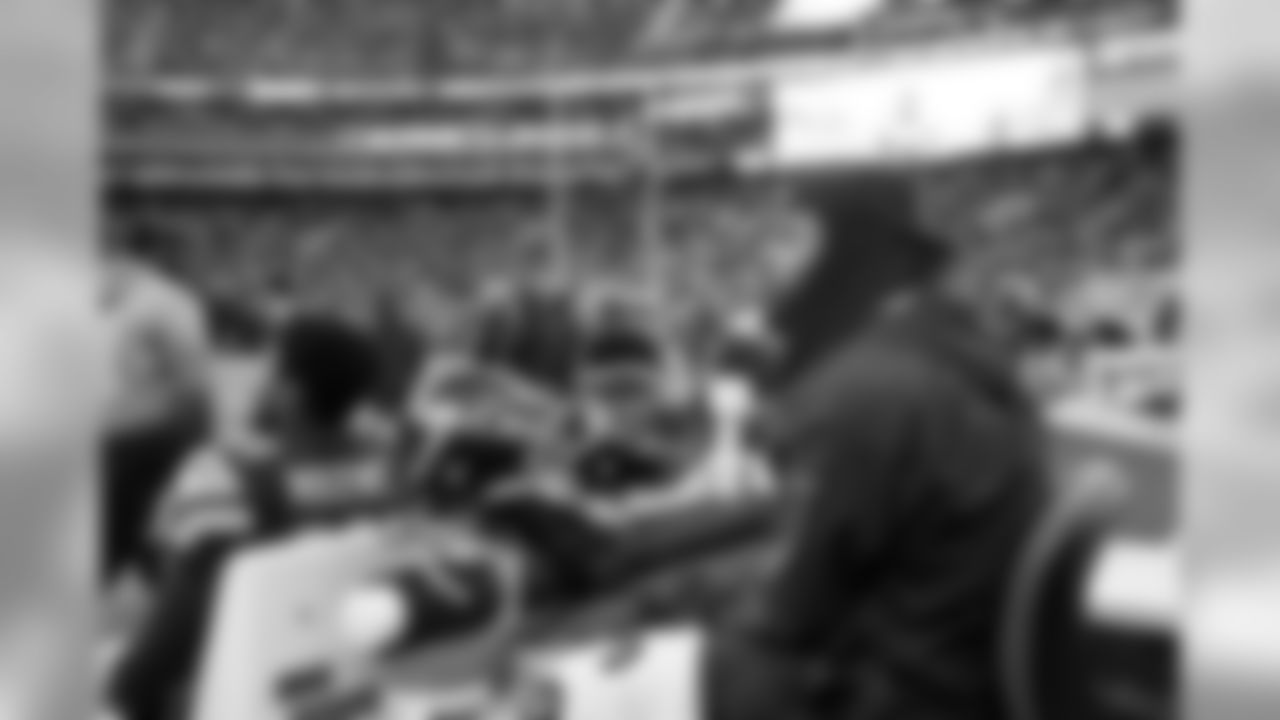 Injured cornerback Richard Sherman watches from behind the Seahawks bench.