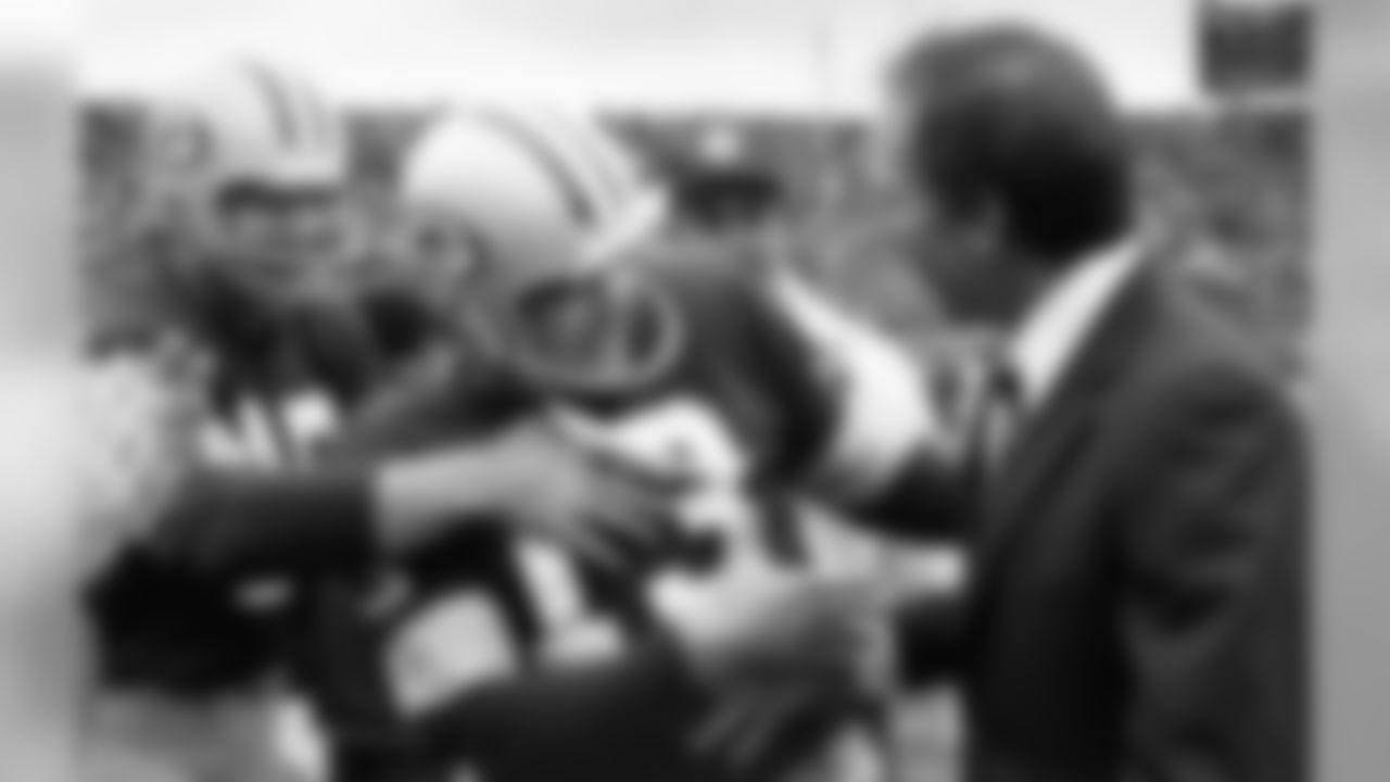 Green Packers head coach Bart Starr shakes hands with kicker Chester Marcol (13) after he kicked a 48 yard field goal with 41 seconds left in game against Tampa Bay in Green Bay Wis. on Sunday, Oct. 29, 1978. At the left is holder Bobby Douglas. The kicked was the margin of victory as the Packers won 9-7. (AP Photo)