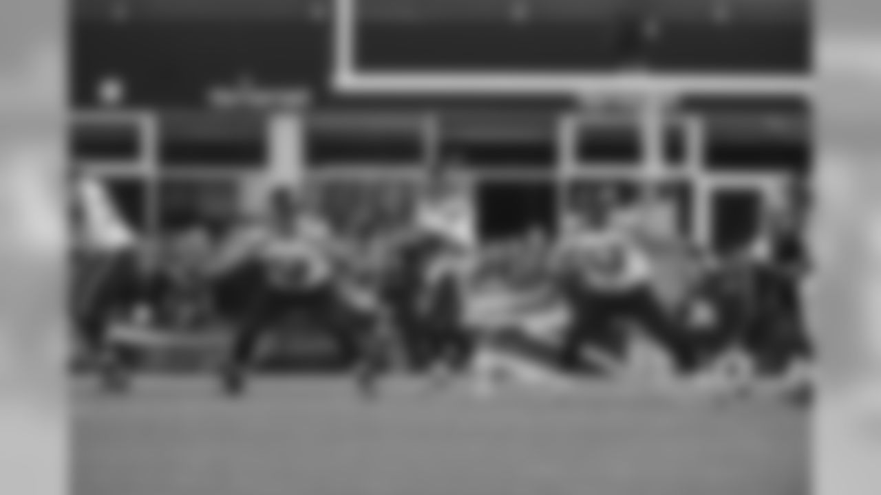Quarterback Russell Wilson drops back and is provided protection by Germain Ifedi, Justin Britt, Mark Glowinski and George Fant.