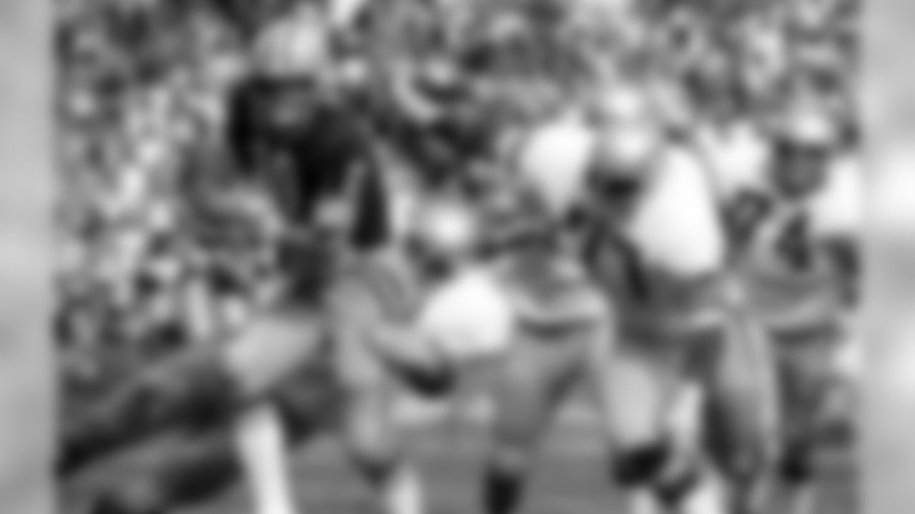 Green Bay Packers quarterback Lynn Dickey (10) is sacked by Seattle Seahawks defensive tackle Steve Niehaus (71) and defensive tackle Richard Harris (77) during an NFL game in Green Bay on October 10, 1976 . The Packers defeated the Seahawks 27-20. (AP Photo/Vernon Biever)