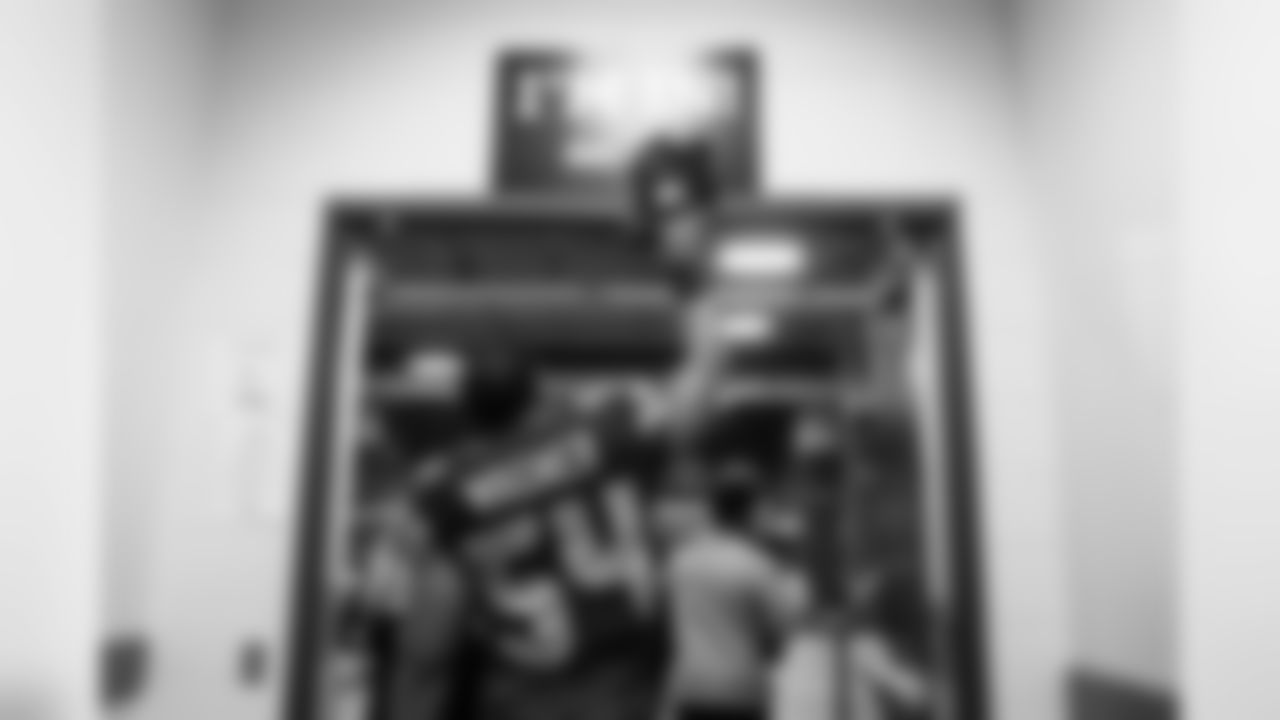 Linebacker Bobby Wagner "taps in" as he leaves the locker room for the field.