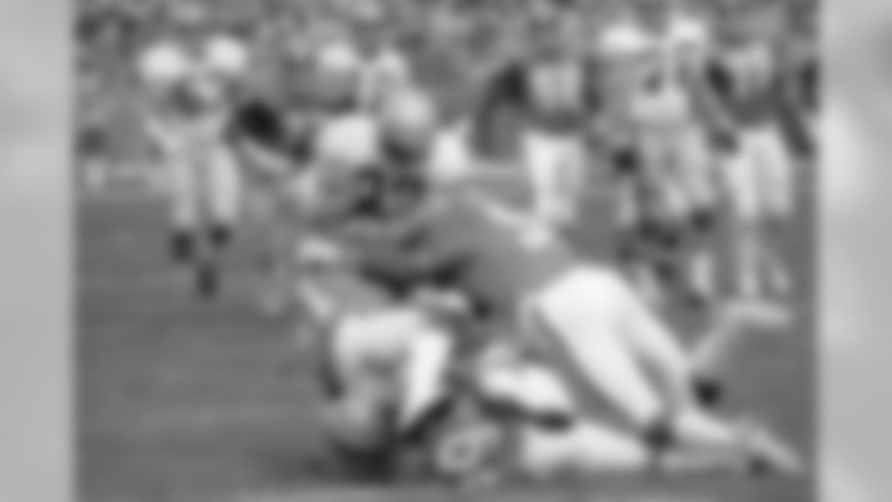 Seattle Seahawks receiver Steve Largent (80) is caught in a crush between Denver Broncos linebackers Bob Swenson, Joe Rizzo and Randy Gradishar during first half action in Denver, Oct. 1, 1978. (AP Photo)