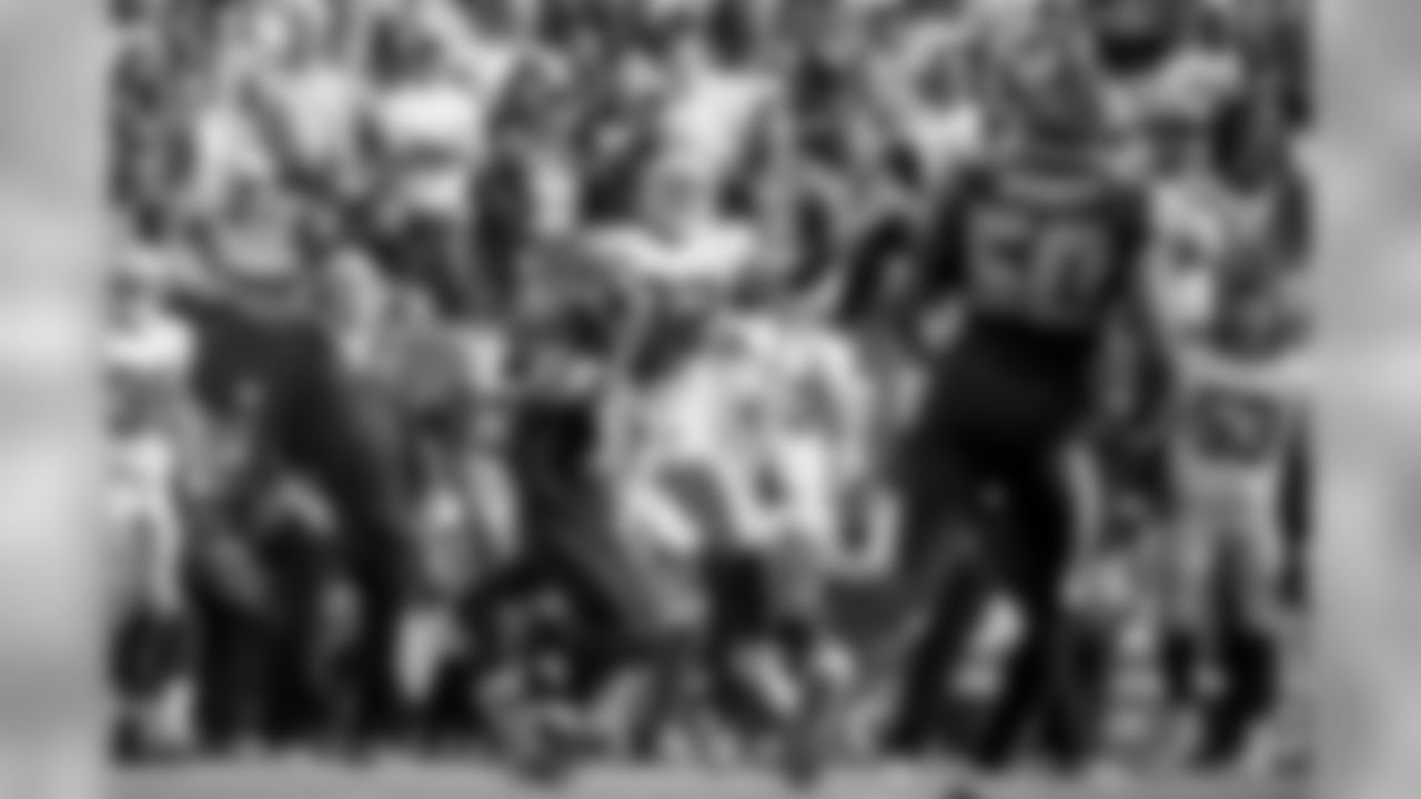 [October 19, 2003]: Seahawks 24 - Bears 17Umpire Darrell Jenkins, left, flies into the pile as Chicago Bears quarterback Chris Chandler (12) scores on a two-point conversion in the fourth quarter against the Seattle Seahawks, Sunday, Oct. 19, 2003, in Seattle. At right are Seahawks' Norman Hand (96) and Cedric Woodard (98). (AP Photo)