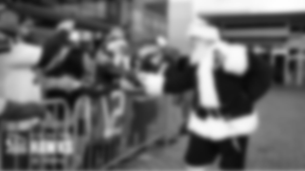 On Sunday, 12s waiting near the team's hotel for a glimpse of the players heading to the buses were greeted by a visit from Santa, who shook hands and gave high-fives to the fans.