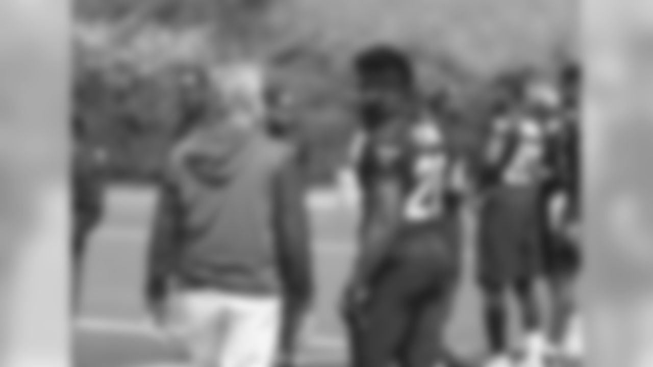 Head coach Pete Carroll and RB Rashaad Penny.