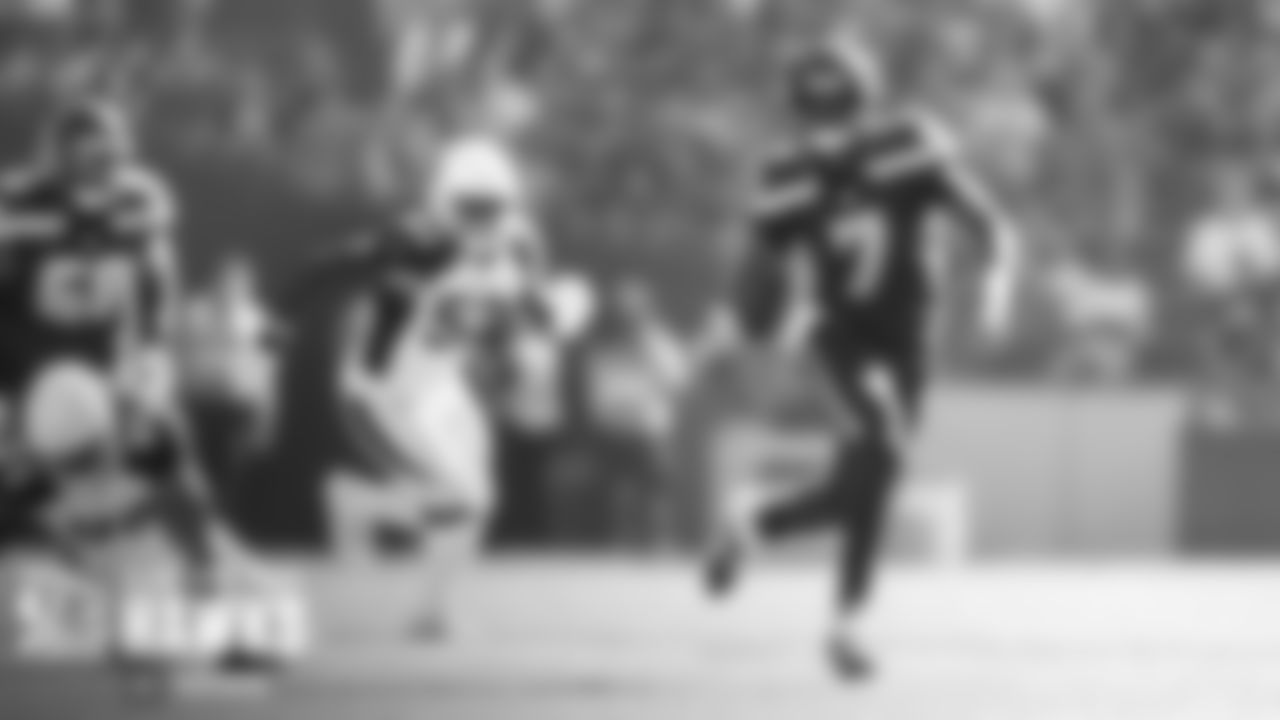 Seattle's Geno Smith escapes the pocket.