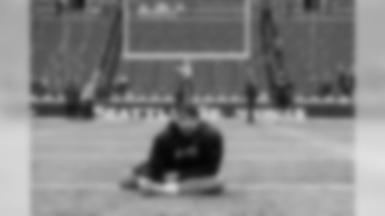 Tackle Garry Gilliam stretches on the field two hours before kickoff.
