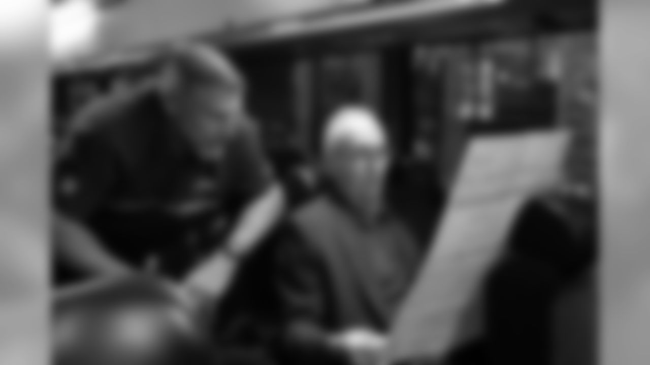 On the staff bus, Seahawks radio play-by-play announcer Steve Raible does game preparation with analyst and former Seahawks linebacker Dave Wyman.