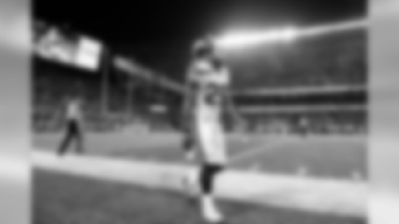 Safety Earl Thomas walks to the sidelines after a series in the second half.