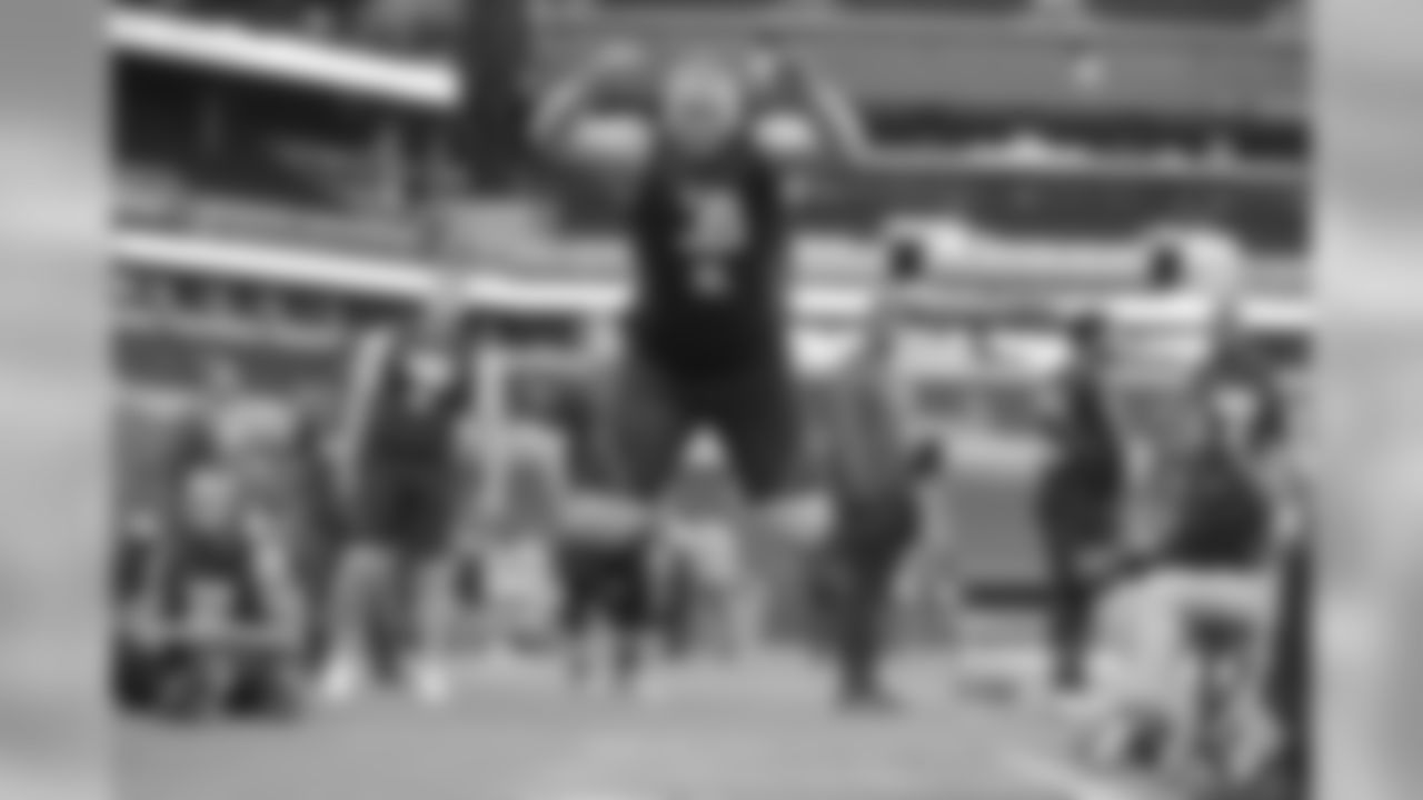 Washington offensive lineman Coleman Shelton participates in the Broad Jump at the 2018 NFL Scouting Combine on Friday, March 2, 2018, in Indianapolis. (AP Photo/Gregory Payan)