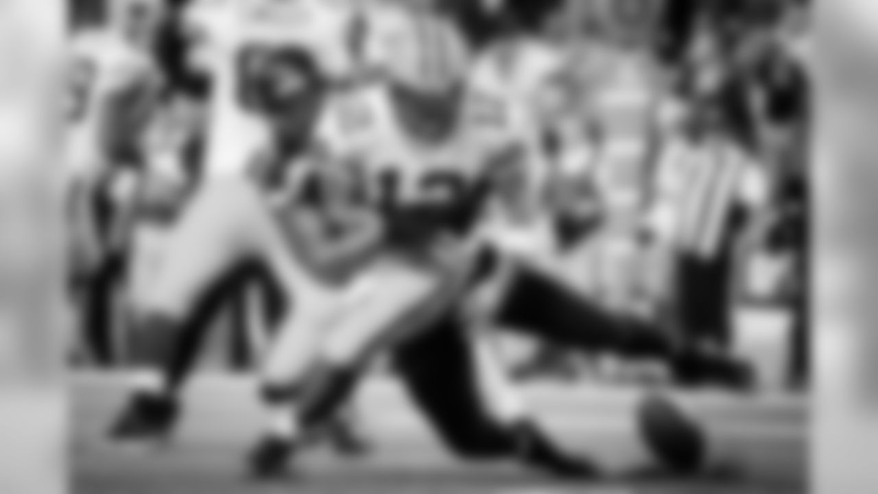 Seattle's Michael Bennett gets a strip sack as he knocks the ball out of the hands of Green Bay quarterback Aaron Rodgers that resulted in a safety.