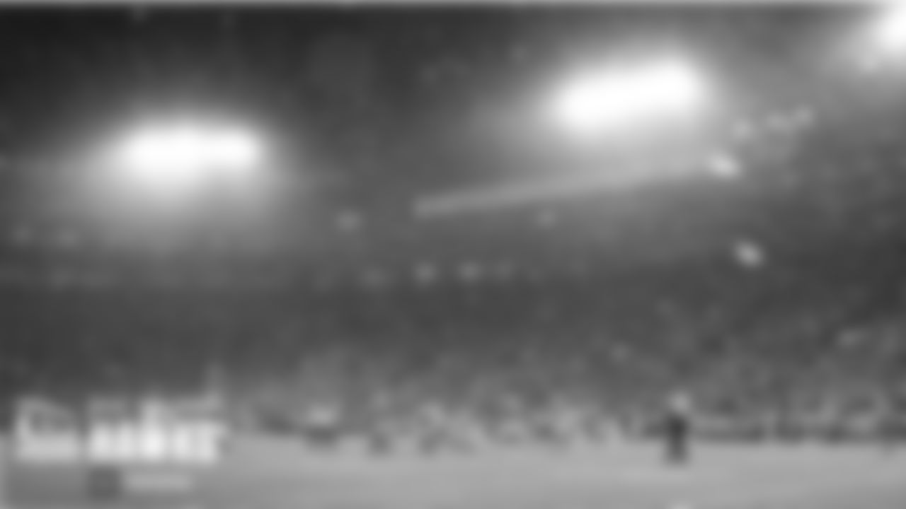 Snowfall swirled around Lambeau Field during the third quarter.