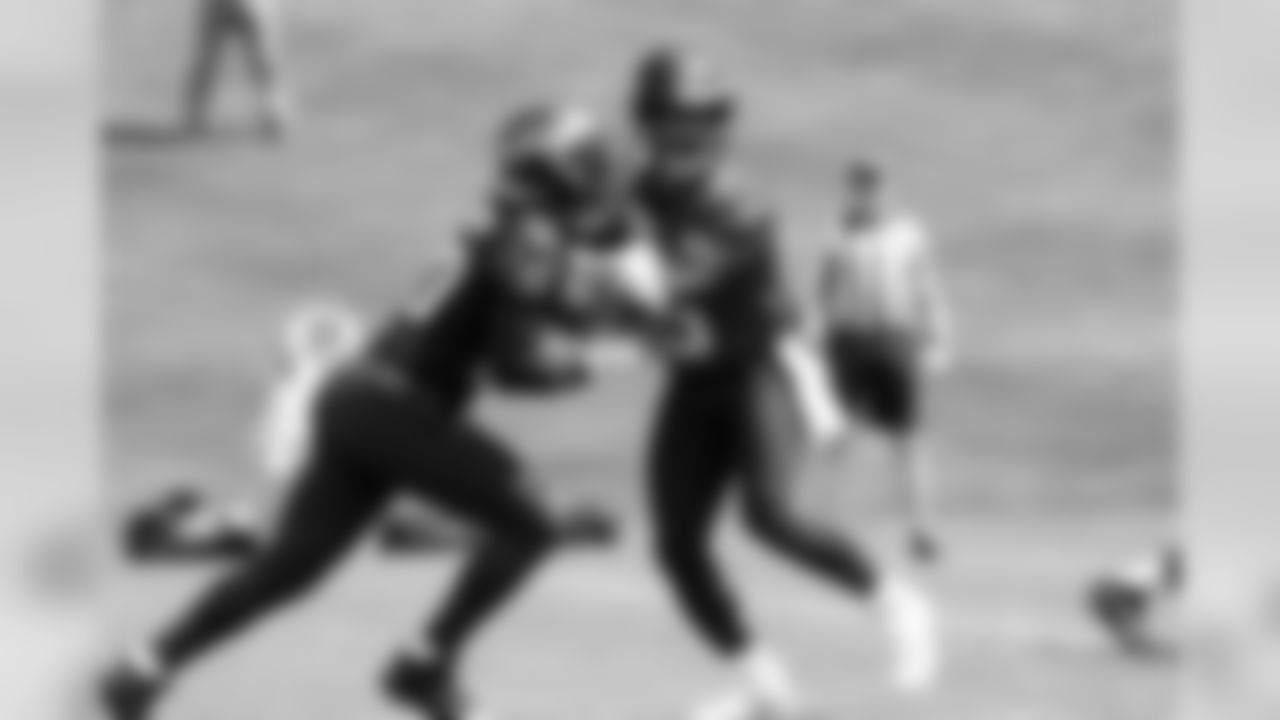 QB Russell Wilson, right, and RB Rashaad Penny, left