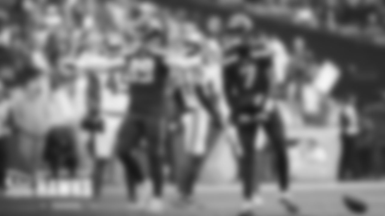Will Dissly and Geno Smith celebrate after Smith scrambled for a first down towards the end of the game.