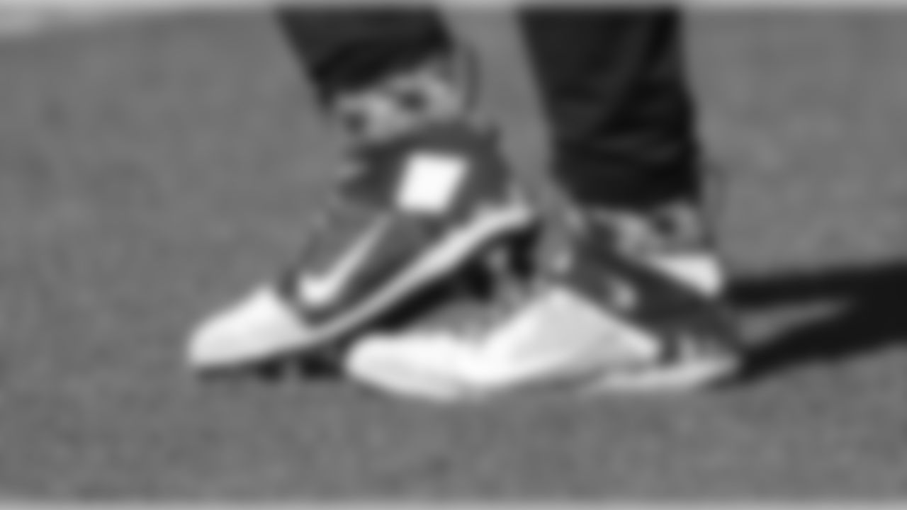 Seattle Seahawks quarterback Russell Wilson's cleats are shown before an NFL football game against the Cleveland Browns, Sunday, Oct. 13, 2019, in Cleveland. (AP Photo/Ron Schwane)
