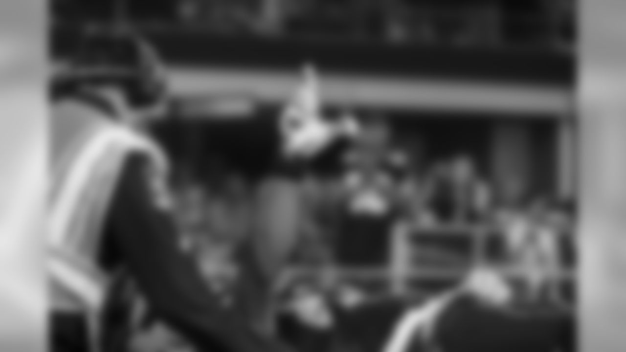 Seahawks receiver Ricardo Lockette gives the "L.O.B." signs as was taken off the field on a stretcher and cart after being hit while on punt coverage. Lockette would remain in Dallas after the team flew home, and underwent surgery.