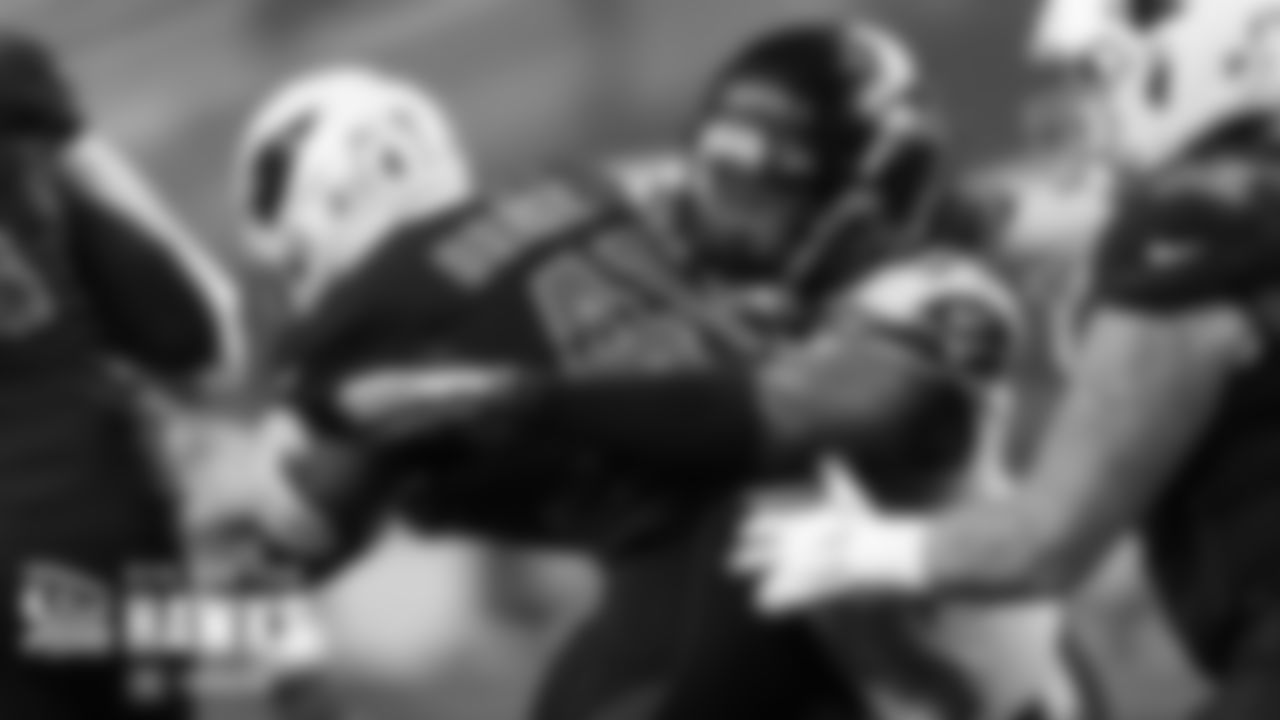 Seahawks defensive lineman Damon "Snacks" Harrison stops Arizona's Kenyan Drake at the line of scrimmage.