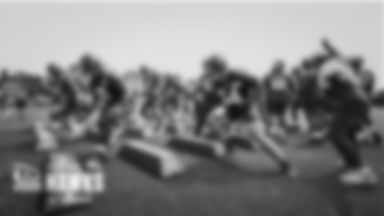 Seahawks offensive players run the "bag drill" at the start of practice.