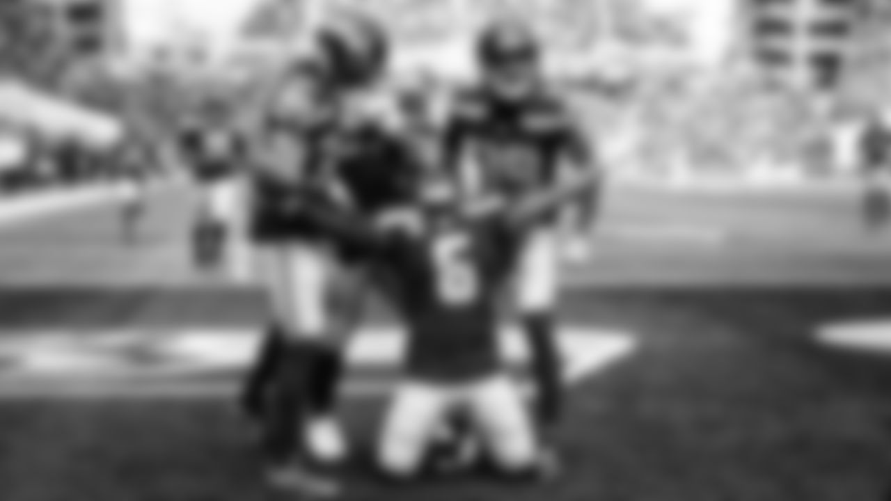 Safety Quandre Diggs celebrates with teammates after his interception. Diggs became the only player to record three or more interceptions in each of the past six seasons.