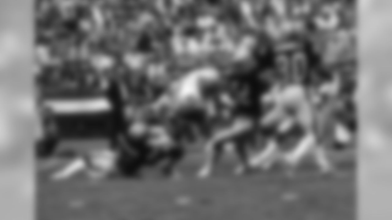 Seattle Seahawks safety Kenny Easley (45) is tackled by Los Angeles Raiders Calvin Muhammad (82) during an NFL game Oct. 30, 1983, in Los Angeles. (NFL Photos via AP)
