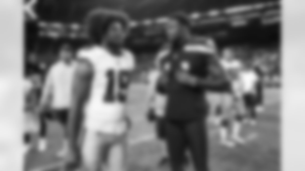 Seahawks wide receiver DK Metcalf (14) speaks with Cowboys wide receiver Dontario Drummond (19) after a preseason game at Lumen Field in Seattle, Wash. on August 19, 2023.
