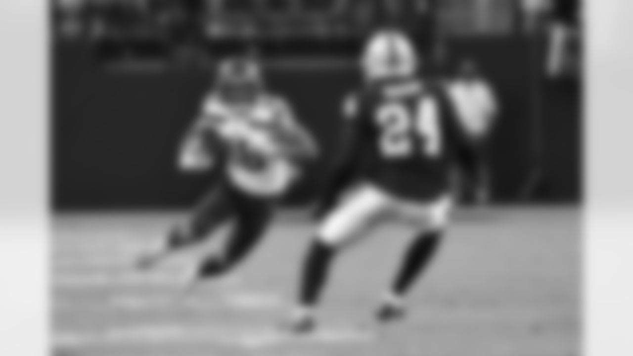 Seattle Seahawks wide receiver Freddie Swain (18) runs with the ball against Las Vegas Raiders defensive back Johnathan Abram (24) during the first quarter of an NFL preseason football game, Saturday, Aug. 14, 2021 in Las Vegas. (Alika Jenner/NFL)