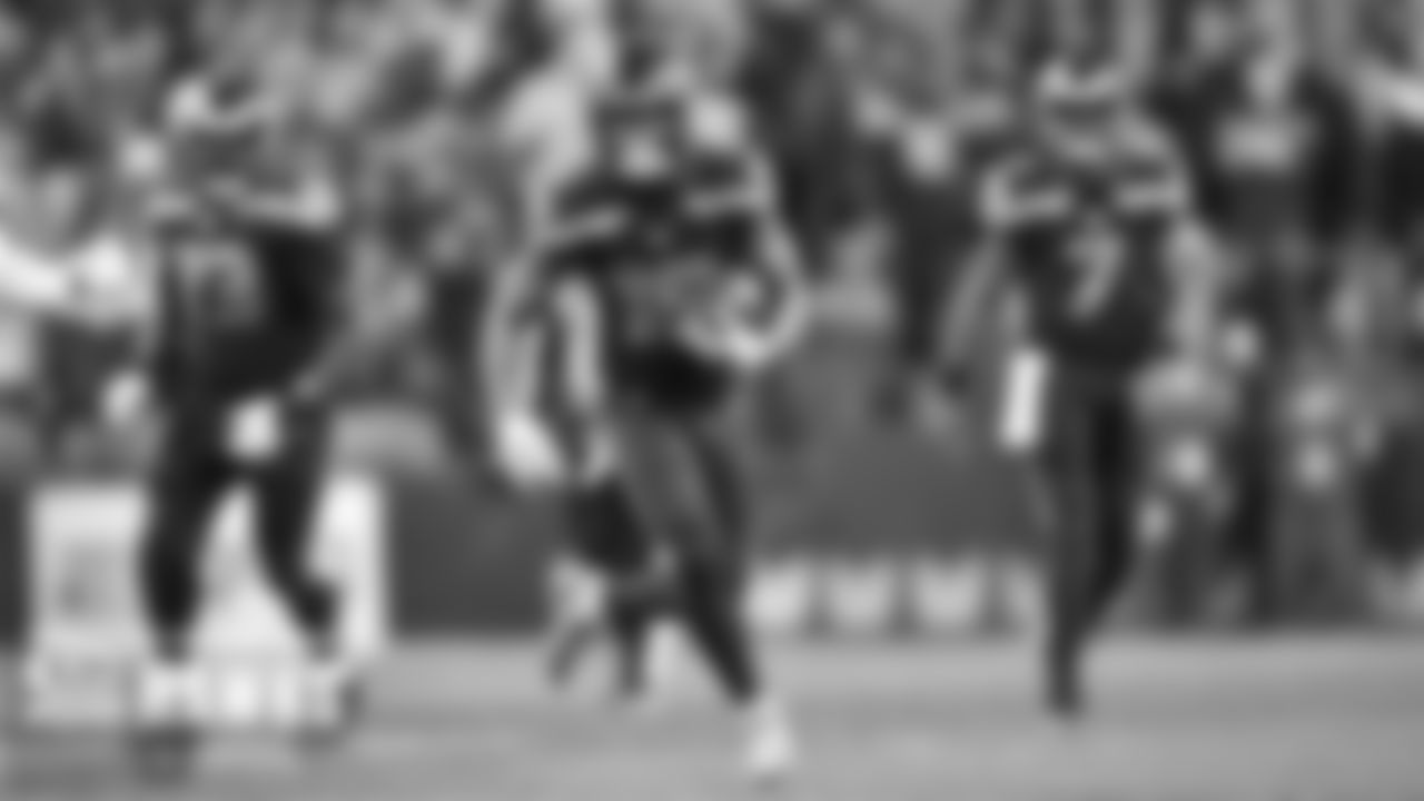 Receiver Freddie Swain gains yards as the Seahawks tried to mount a comeback in the fourth quarter.