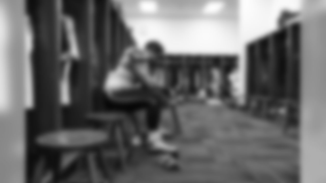 Offensive tackle Garry Gilliam sits alone at his locker before taking the field to face the Ravens.