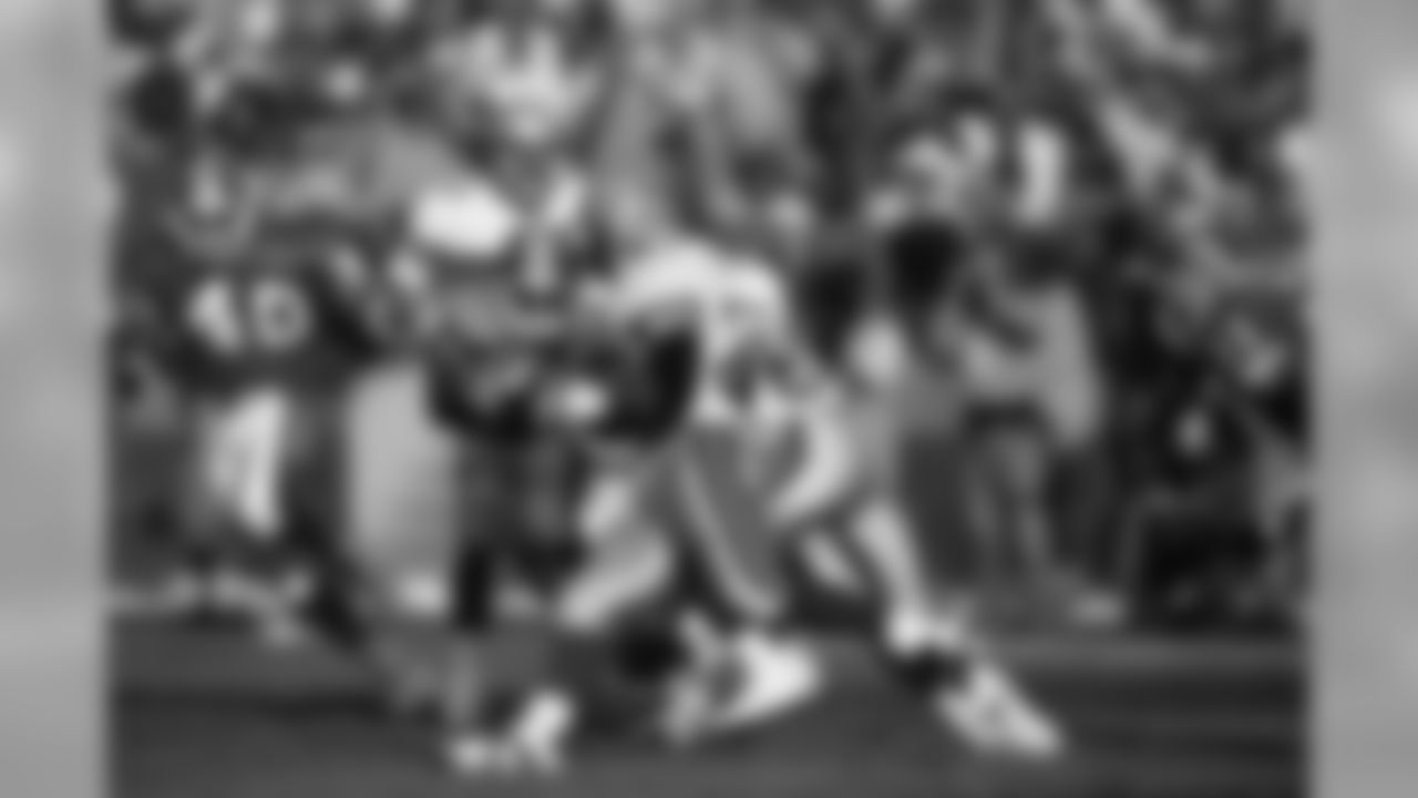 Seattle Seahawks kick returner Jon Vaughn (22) returns a kick during an NFL game against the Denver Broncos in Denver, Oct. 31, 1993. The Broncos defeated the Seahawks 28-17. (AP Photo/Eric Lars Bakke)