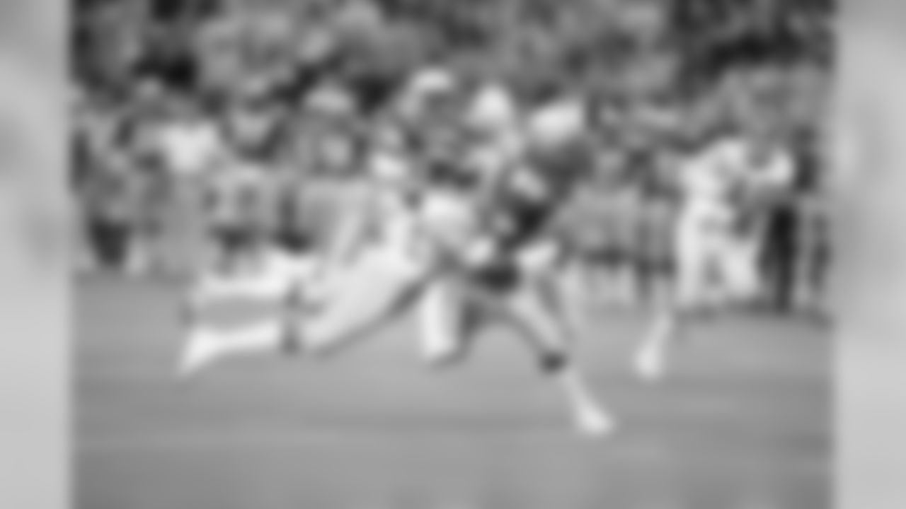 Seattle Seahawks receiver Steve Largent (80) is brought down by San Diego's Gill Byrd (22) after catching a pass good for 26 yards in the first quarter of their NFL game in Seattle, Sept. 18, 1983. (AP Photo/DE)