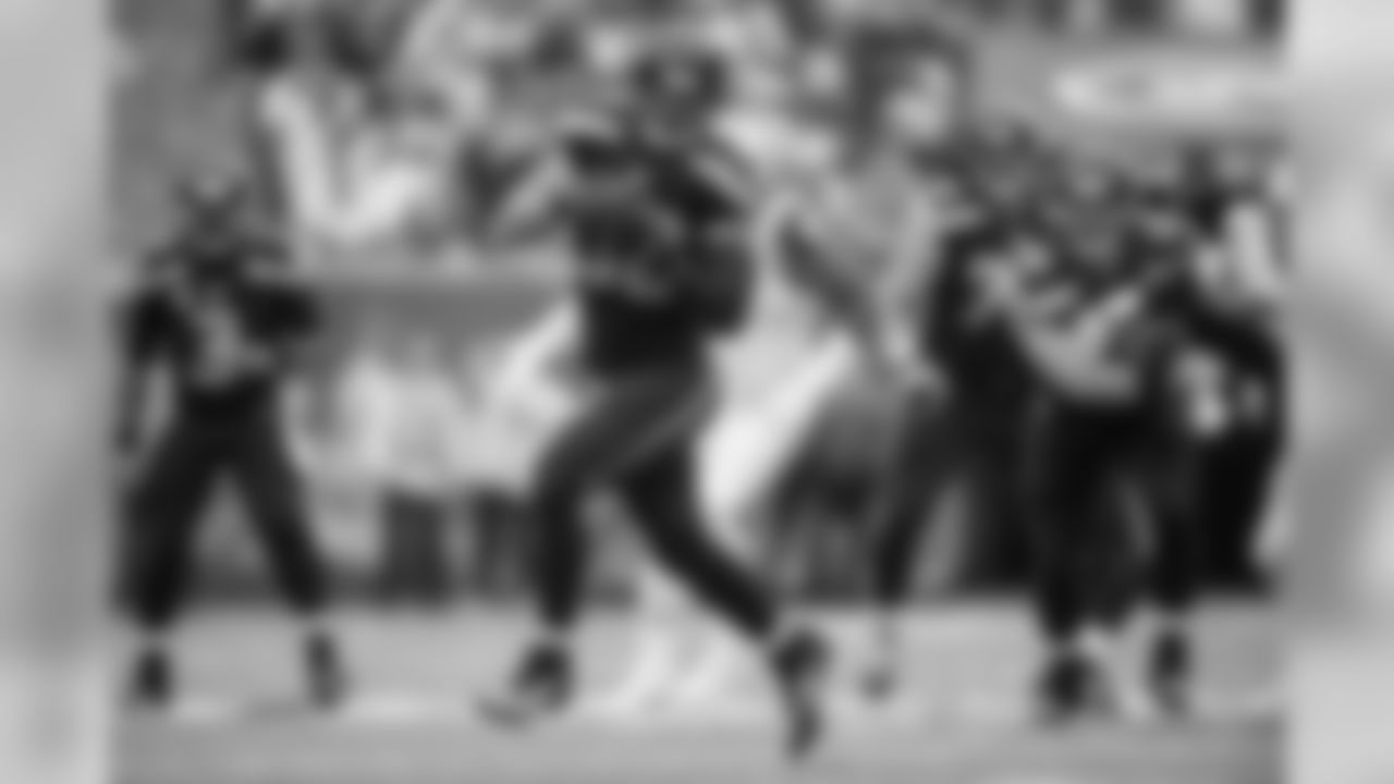 Tight end Jimmy Graham rumbles upfield with a 12-yard gain in the third quarter, one of Graham's six catches which netted 113 yards in the victory.