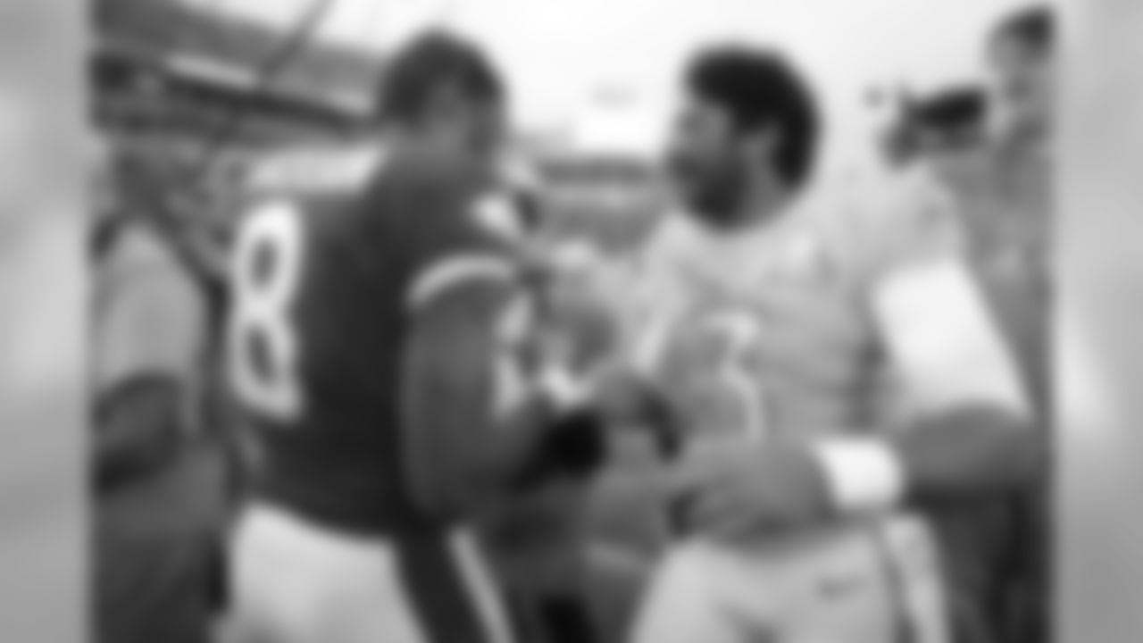Baltimore Ravens quarterback Lamar Jackson (8) and Seattle Seahawks quarterback Russell Wilson (3) after the 2020 NFL Pro Bowl football game, Sunday, Jan. 26, 2020 in Orlando, Fla. (Logan Bowles/NFL)