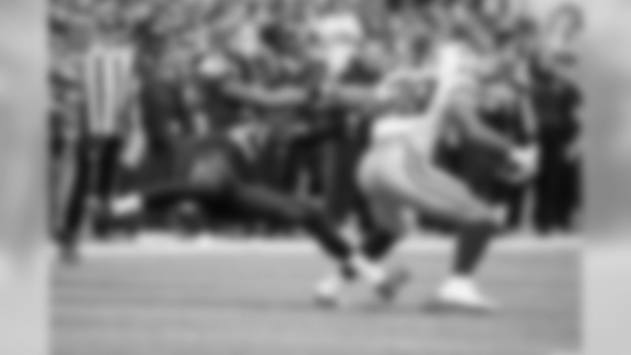 Cornerback Richard Sherman grabs the arm of Dallas running back DeMarco Murray in the fourth quarter.