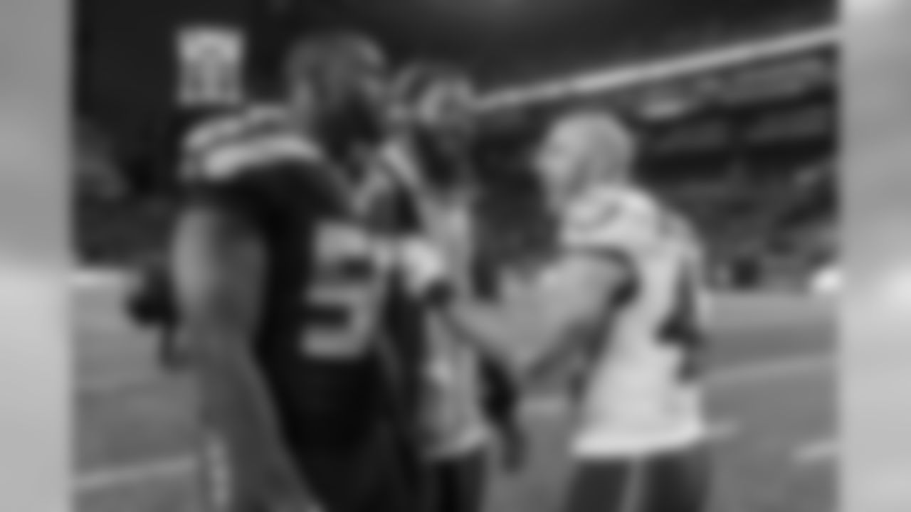 Seahawks Cliff Avril and Michael Bennett joked with former Super Bowl teammate and current Eagles player Chris Maragos after the game.
