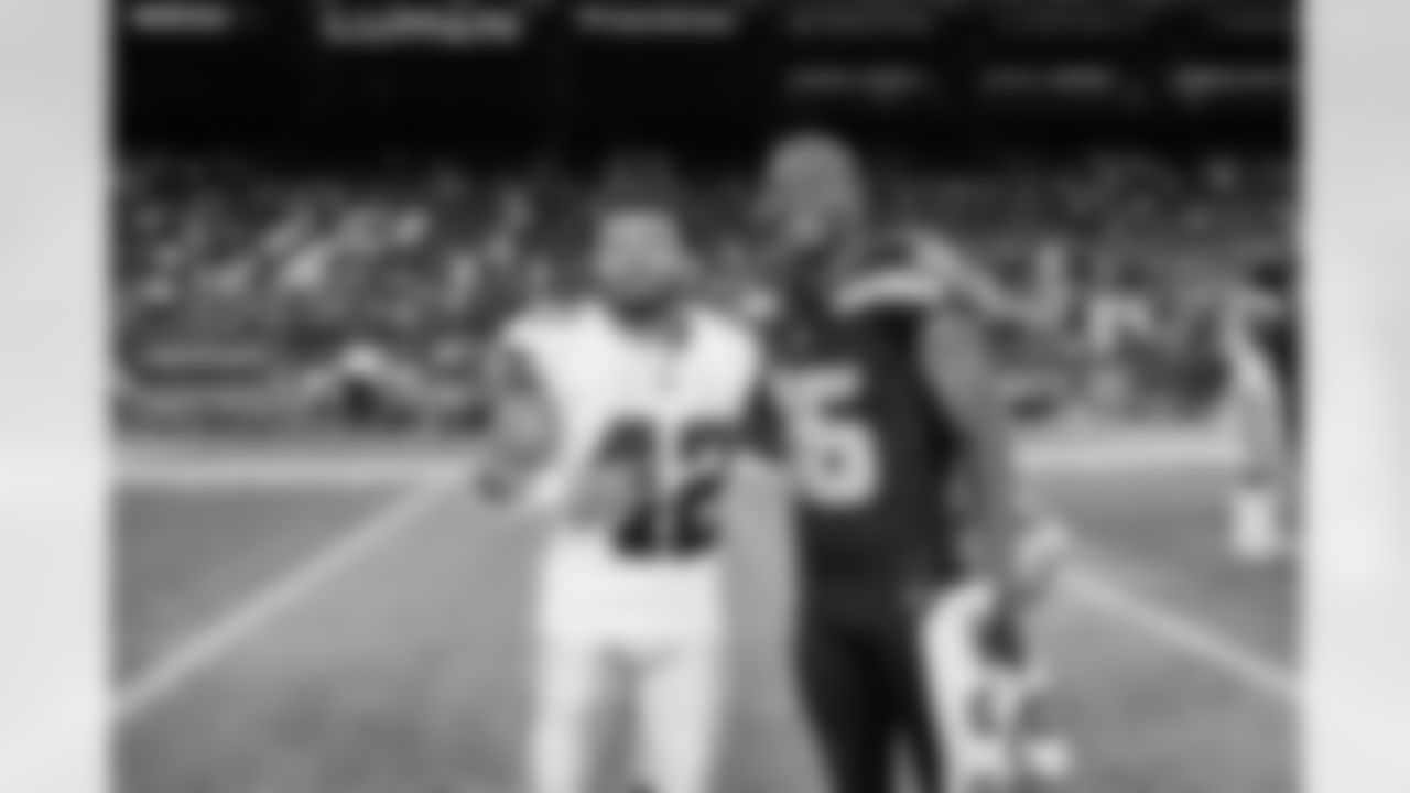 Seahawks wide receiver Tyler Lockett (16) poses with Cowboys running back Deuce Vaughn after a preseason game at Lumen Field in Seattle, Wash. on August 19, 2023.