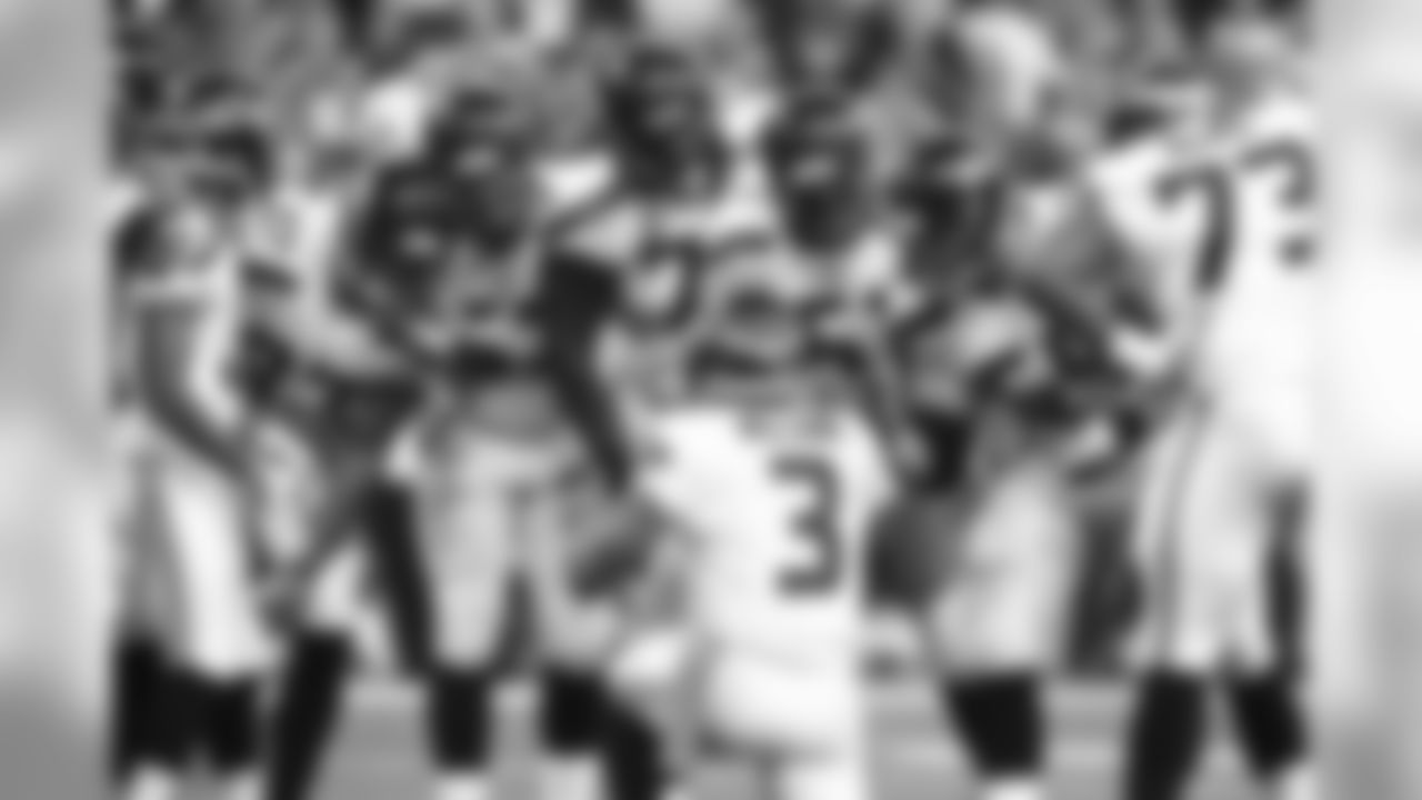 Seattle Seahawks quarterback Russell Wilson calls a play in the huddle during the second half of an NFL football game against the Indianapolis Colts in Indianapolis, Sunday, Oct. 6, 2013. (AP Photo/Brent R. Smith)