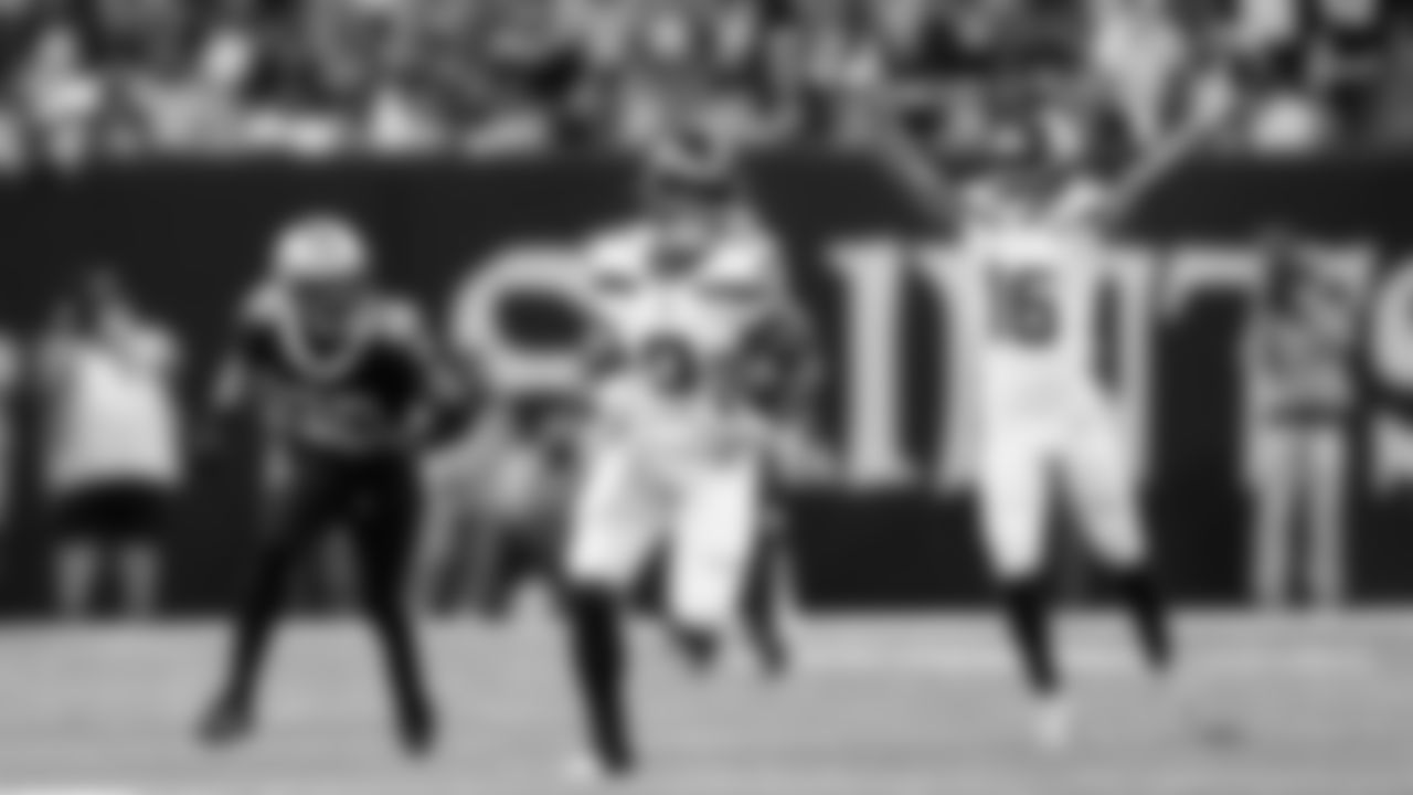 Seahawks running back Kenneth Walker III heads to the end zone on a 69-yard run as Tyler Lockett begins the celebration behind him.
