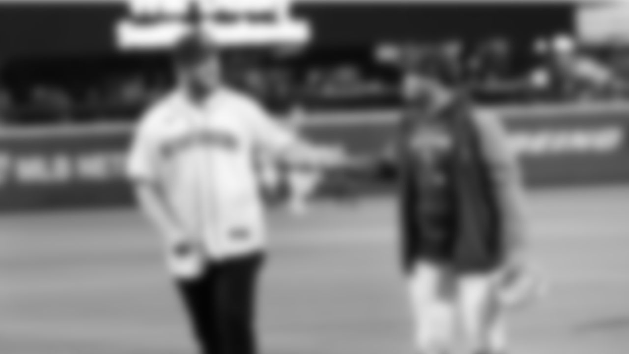 Seattle Seahawks tight end Will Dissly throws out the ceremonial first pitch at the Seattle Mariners game on April 21, 2022 at T-Mobile Park.