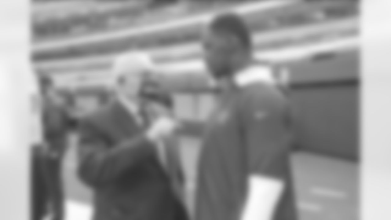 Dallas Cowboys owner Jerry Jones (left) talks with defensive end Aldo Smith (right) before an NFL football game against the Los Angeles Rams, Sunday, Sept. 13, 2020, in Inglewood, Calif. The Rams defeated the Cowboys, 20-17. (James D. Smith via AP)