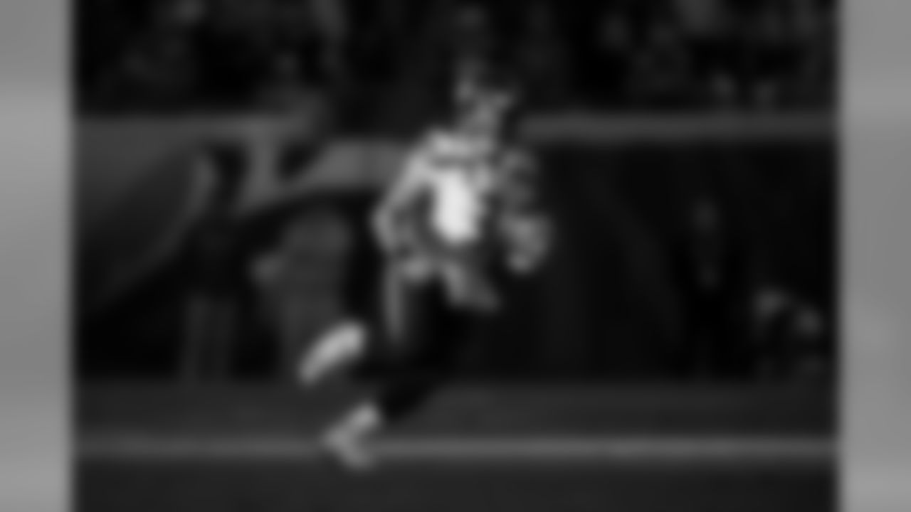 Seahawks quarterback Russell Wilson runs for daylight during the first quarter.