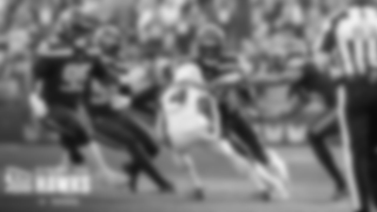 Seahawks defenders Myles Adams, Jordyn Brooks, Darrell Taylor and Ryan Neal leave no room for escape.