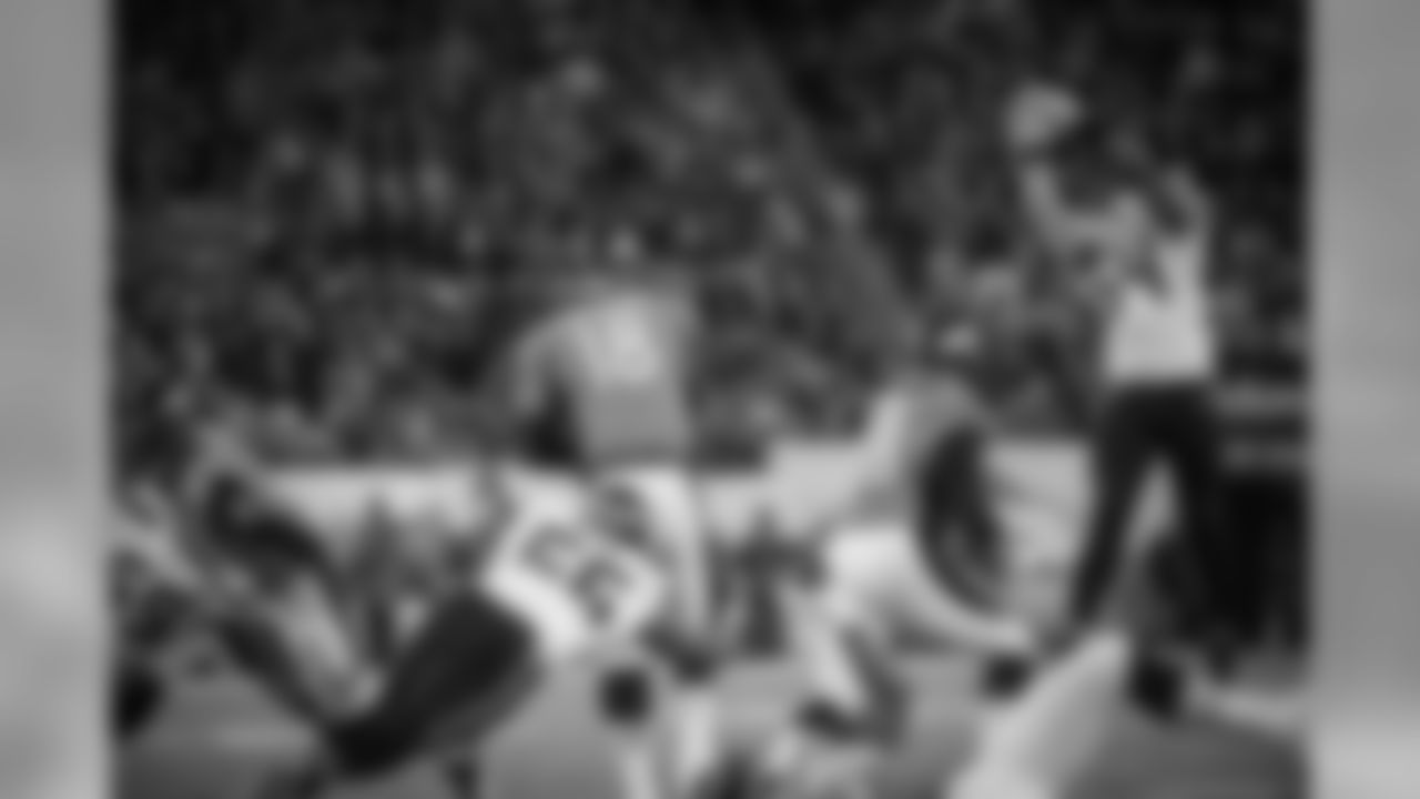With pressure from the backside from Seattle's Cliff Avril, Denver quarterback Peyton Manning's pass sails past his intended receiver and the ball was intercepted by Seattle's Kam Chancellor