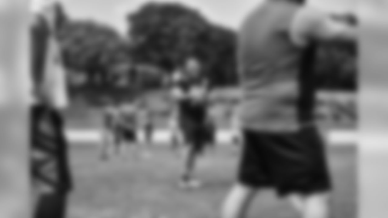 Steelers fans take part in on-field drills during Men's Fantasy Camp.