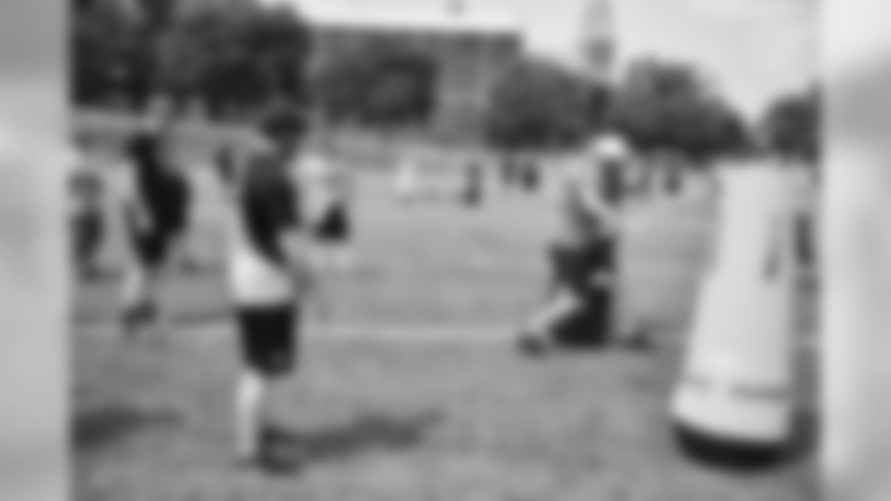 Steelers fans take part in on-field drills during Men's Fantasy Camp.