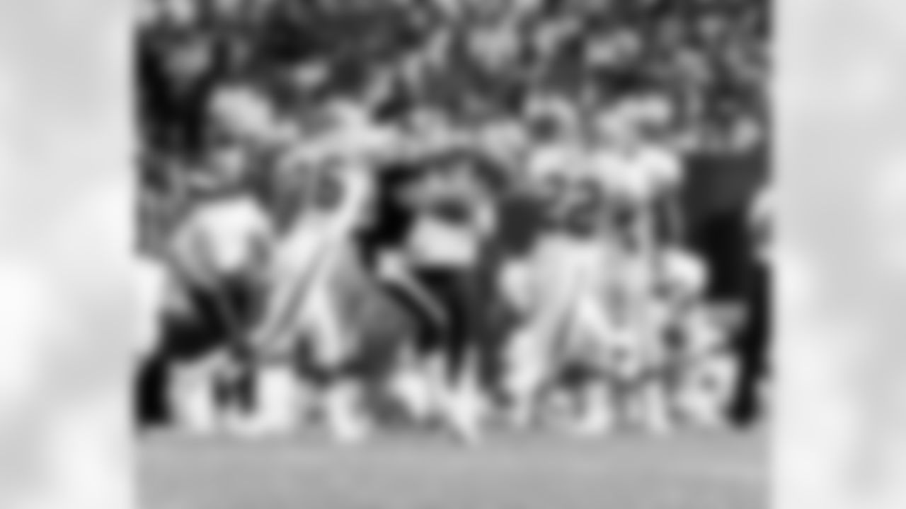 Action photograph of wide receiver Louis Lipps #83 during his time with the Steelers.
