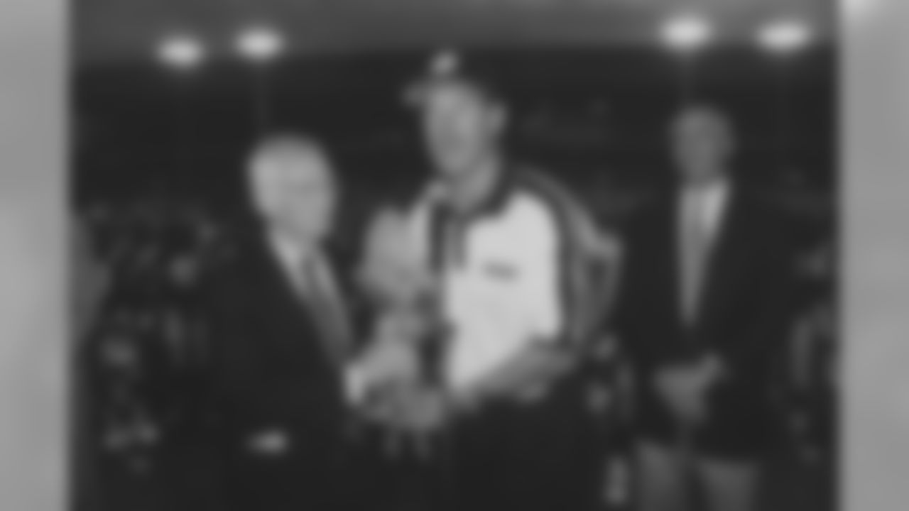 Dan Rooney holds the American Bowl trophy with Coach Bill Cowher following their victory over the Chicago Bears in Ireland.